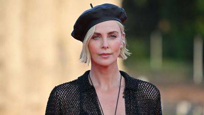 Charlize Theron Brushes Off Those ‘Bad Plastic Surgery’ Rumors: ‘B*tch, I’m Just Aging' - www.glamour.com - Italy