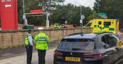 Police and paramedics rush to scene after incident near KFC - www.manchestereveningnews.co.uk - Manchester