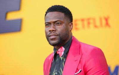 Kevin Hart in wheelchair after tearing abdomen in race with ex-NFL player - www.nme.com - county Hart