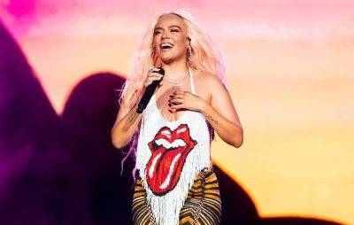 Karol G makes history as the first Latin female artist to headline Lollapalooza 2023 - www.nme.com - New Jersey - Colombia