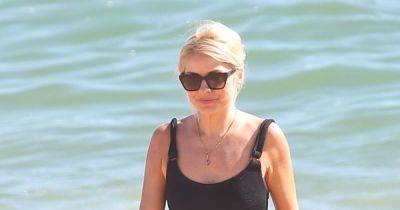 Fun in the sun! Holly Willoughby makes a splash in swimsuit during This Morning break in Portugal - www.ok.co.uk - Portugal