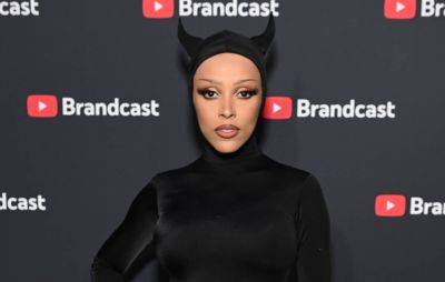 Doja Cat shares Christina Ricci-starring new video, changes album artwork after metal band comparisons - www.nme.com - Germany