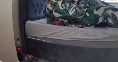 Scots mum horrified after security camera captures stranger crawling into her bed - www.dailyrecord.co.uk - Scotland