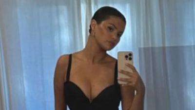 Selena Gomez Is Giving Bombshell in This Black One-Piece Swimsuit - www.glamour.com