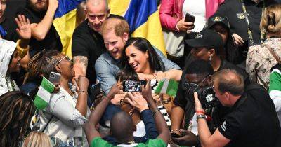 Harry and Meghan look so loved up as they continue PDA-filled appearances at Invictus Games - www.ok.co.uk - Ukraine - Germany - Nigeria