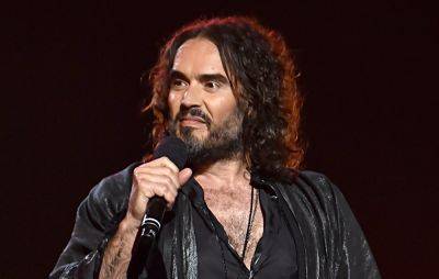 Russell Brand plays London show to thousands amid sexual assault allegations - www.nme.com - London