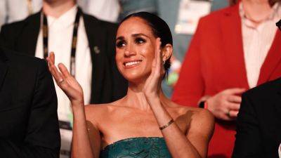 Meghan Markle Gives All-Over Cutouts a Chance in a Strapless Green Dress - www.glamour.com