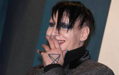 Marilyn Manson fined for blowing his nose and spitting at videographer - www.nme.com - state New Hampshire