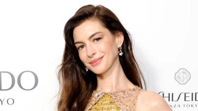 Anne Hathaway Is Twinning With Her Oscar in This Jaw-Dropping Gold Dress - www.glamour.com - USA - Hollywood - New York - Berlin - city Venice
