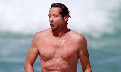 Simon Baker Hits the Beach for Shirtless Beach Day with Son Claude - www.justjared.com - Australia