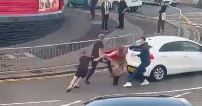 Teenager 'stabbed' in daytime brawl on Scots street while cars try to drive past - www.dailyrecord.co.uk - Scotland - Beyond