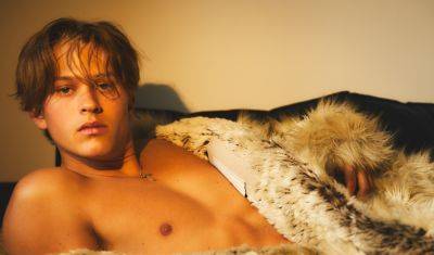 Deacon Phillippe Strips Down, Wears Just a Fur Coat for 'King Kong' Magazine Cover Story - www.justjared.com