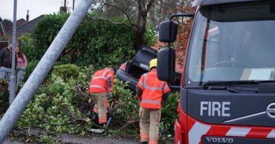 Emergency services descend on main road after car ploughed into hedge - www.manchestereveningnews.co.uk - Manchester - county Lane
