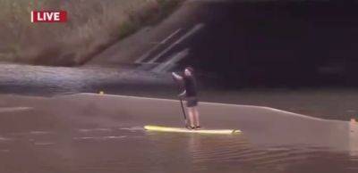 Only In California: TV News Crew Catches Man Paddling Surfboard Down Flooded Freeway - deadline.com - California - county San Diego