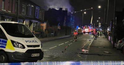 Road closed as crews begin second day tackling 'massive' fire at former hotel - www.manchestereveningnews.co.uk - Manchester