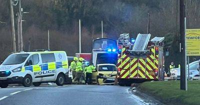 Police close busy Scots road after horror two-vehicle car crash - www.dailyrecord.co.uk - Scotland