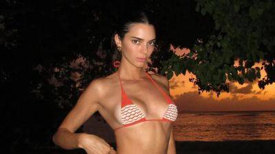 Kendall Jenner Distracts From Bad Bunny Reconciliation Rumors With Cheeky Thong Bikini Photos - www.glamour.com - Barbados - Puerto Rico