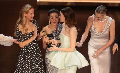Michelle Yeoh Explains That Awkward Handoff Of Oscar To Emma Stone - deadline.com