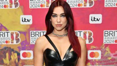 Dua Lipa Matched Her Manicure to Her Burgundy Hair at The 2024 Brit Awards - www.glamour.com - Italy - Egypt