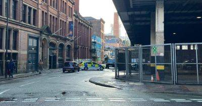 Police close road in city centre after crash between bus and car - www.manchestereveningnews.co.uk - Manchester