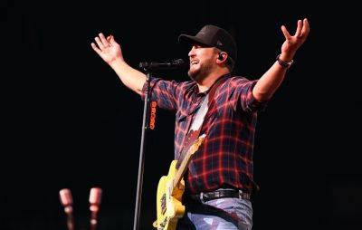 Luke Bryan falls on stage after slipping on fan’s phone: “My lawyer will be calling” - www.nme.com - USA - Canada