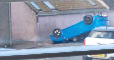 Car flips after horror crash on Scots road as police close off scene - www.dailyrecord.co.uk - Scotland - Beyond