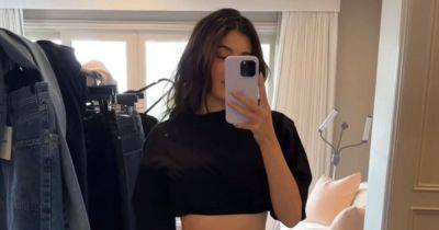 Kylie Jenner quashes Timothee Chalamet pregnancy rumours as she shows off toned stomach - www.ok.co.uk