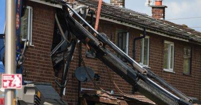 Dramatic images show front of Wigan home crushed by fallen crane amid Storm Kathleen winds - www.manchestereveningnews.co.uk - Manchester - county Lane