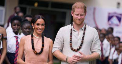 Prince Harry and Meghan Markle flash huge smiles as they land in Nigeria after Royal Family's 'snub' in UK - www.ok.co.uk - Britain - London - Los Angeles - Nigeria - city Abuja