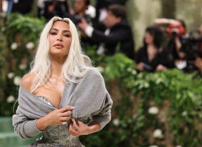 Trolls question Kim Kardashian’s ‘raggedy’ Met Gala sweater cover-up - nypost.com - Kardashians