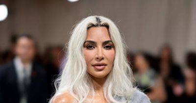Kim Kardashian shocks with tiny waist in corset at Met Gala while others slam 'grandad cardigan' - www.ok.co.uk - New York