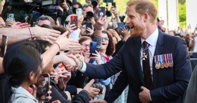 Prince Harry beams on lively walkabout after Invictus Games service as public chants 'we love you' - www.ok.co.uk - London - USA